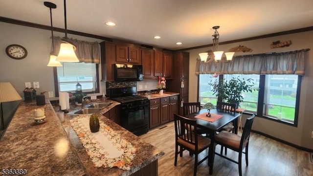 7 Makepeace Dr Unit 7, Jefferson Twp, NJ 07438 - kitchen with black appliances, crown molding, plenty of natural light, a chandelier, and light wood-style floors