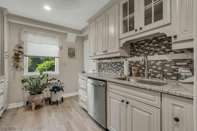 93A Troy Dr Unit A, Springfield Twp, NJ 07081 - kitchen with stainless steel dishwasher, a sink, baseboards, backsplash, and light stone counters