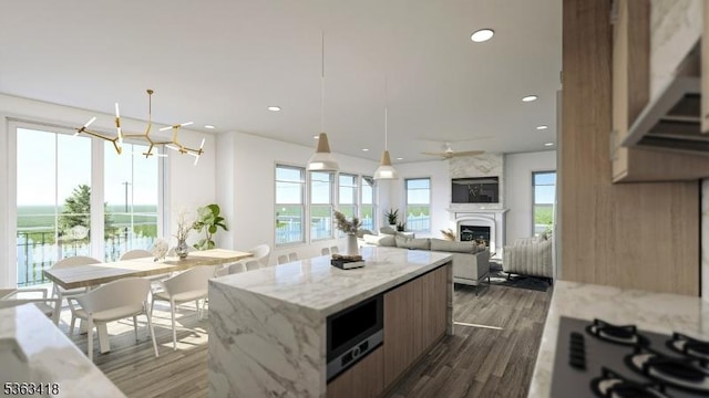 491 Central Ave Unit 4, New Providence Boro, NJ 07974 - kitchen with gas cooktop, a fireplace, dark wood finished floors, a kitchen island, and a chandelier
