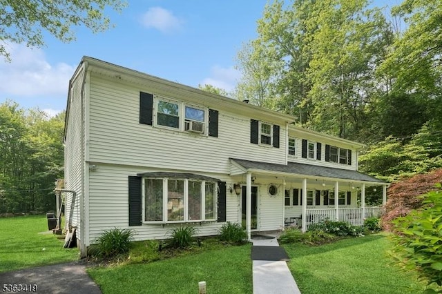 1 Beaver Brook Dr, Vernon Twp, NJ 07461 - view of front of house with a front lawn and a porch