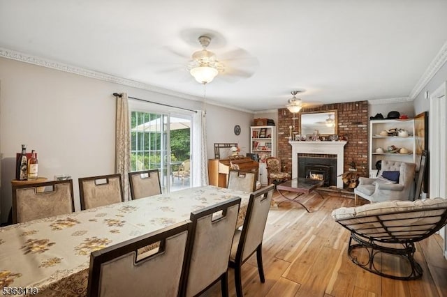 1 Beaver Brook Dr, Vernon Twp, NJ 07461 - dining area featuring ceiling fan, light wood finished floors, crown molding, and a brick fireplace