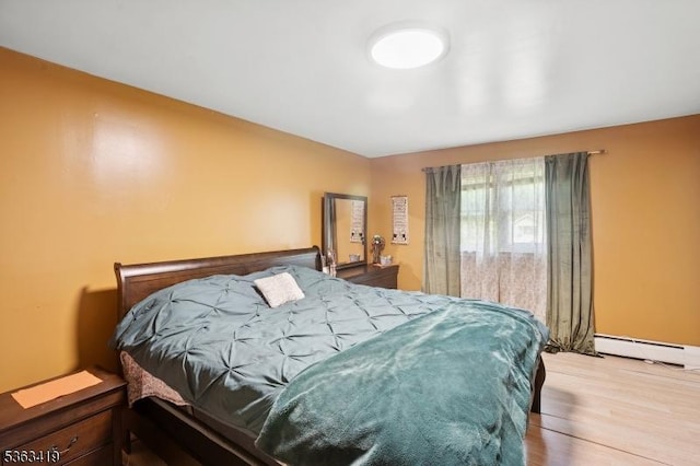 1 Beaver Brook Dr, Vernon Twp, NJ 07461 - bedroom featuring a baseboard radiator and wood finished floors