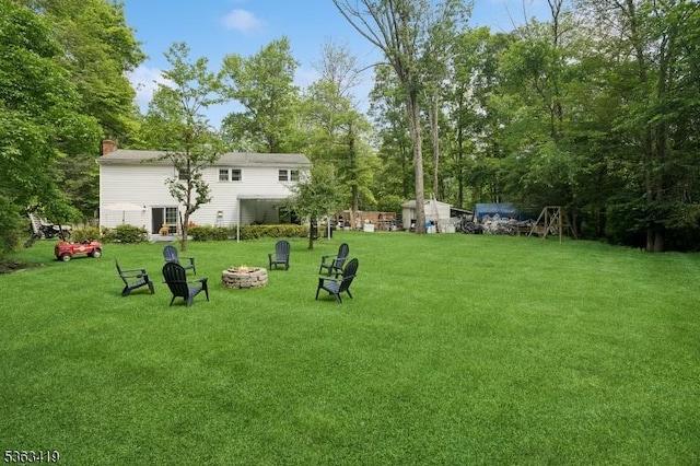 1 Beaver Brook Dr, Vernon Twp, NJ 07461 - view of grassy yard featuring a fire pit and view of scattered trees