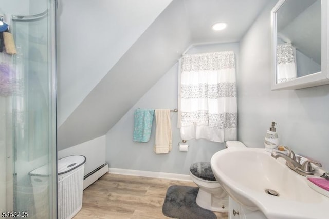 56 Holsman St Unit 2, Paterson City, NJ 07522 - full bathroom with baseboard heating, wood finished floors, a shower, lofted ceiling, and vanity