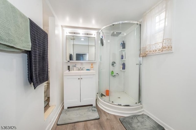 56 Holsman St Unit 2, Paterson City, NJ 07522 - bathroom with wood finished floors, vanity, and a shower stall