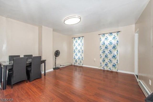 56 Holsman St Unit 2, Paterson City, NJ 07522 - unfurnished dining area with a baseboard heating unit and wood finished floors