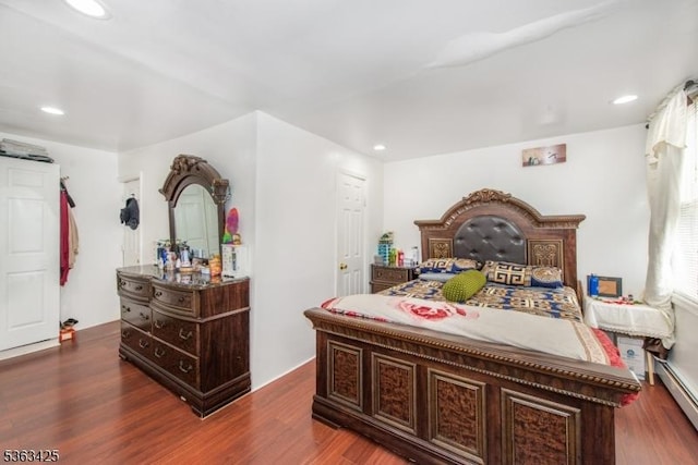 56 Holsman St Unit 2, Paterson City, NJ 07522 - bedroom featuring a baseboard heating unit, wood finished floors, and recessed lighting