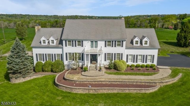 3 Covered Bridge Rd, Delaware Twp, NJ 08559 - view of front of home with a balcony, a front lawn, and a chimney