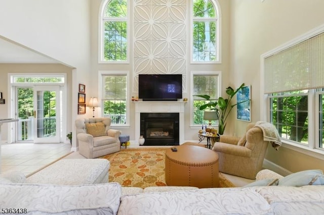 22 Young Ct, Chester Twp, NJ 07930 - living room with a high ceiling, a glass covered fireplace, and plenty of natural light