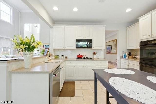22 Young Ct, Chester Twp, NJ 07930 - kitchen featuring black appliances, a sink, decorative backsplash, white cabinets, and light countertops