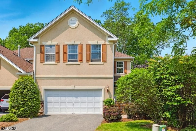 22 Young Ct, Chester Twp, NJ 07930 - traditional-style house with an attached garage, asphalt driveway, and stucco siding
