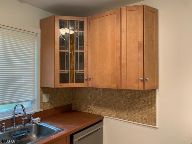 17 Village Way Unit 4, Vernon Twp, NJ 07462 - kitchen featuring dishwasher, dark countertops, decorative backsplash, brown cabinetry, and glass insert cabinets