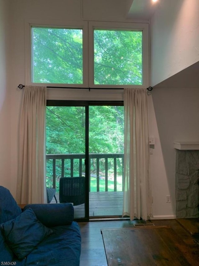 17 Village Way Unit 4, Vernon Twp, NJ 07462 - doorway to outside featuring wood finished floors and a high ceiling