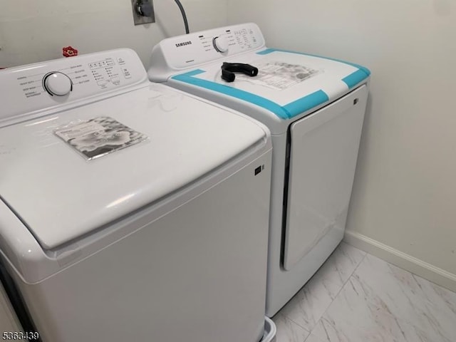 17 Village Way Unit 4, Vernon Twp, NJ 07462 - washroom with independent washer and dryer and light marble finish flooring