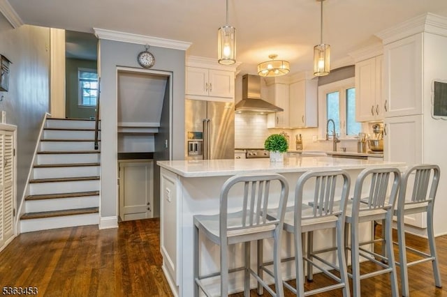 76 W Valley View Dr, Morristown Town, NJ 07960 - kitchen with high end refrigerator, wall chimney range hood, dark wood finished floors, backsplash, and a kitchen island