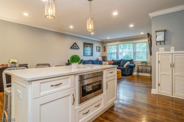 76 W Valley View Dr, Morristown Town, NJ 07960 - kitchen with stainless steel microwave, ornamental molding, open floor plan, a kitchen breakfast bar, and white cabinetry