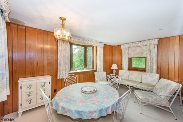 38 Longview Dr, Hanover Twp, NJ 07981 - dining space featuring wood walls, a chandelier, and carpet