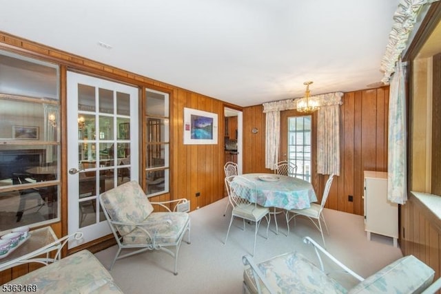38 Longview Dr, Hanover Twp, NJ 07981 - dining area featuring wood walls, a chandelier, and carpet flooring