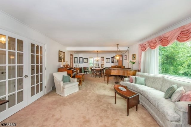 38 Longview Dr, Hanover Twp, NJ 07981 - carpeted living area featuring french doors, a chandelier, and crown molding