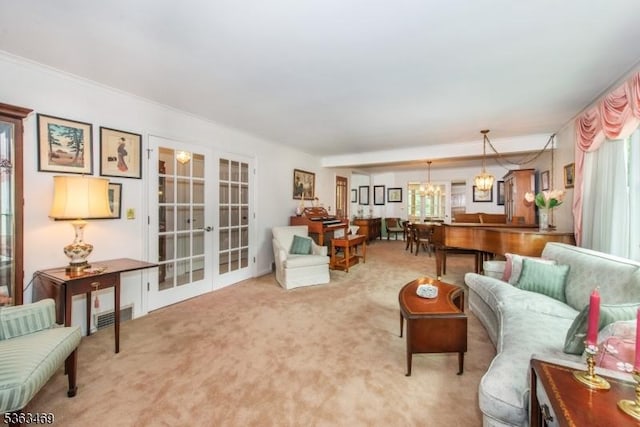 38 Longview Dr, Hanover Twp, NJ 07981 - carpeted living room with french doors and a chandelier