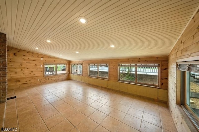 34 Millbrook Rd, Harding Twp, NJ 07976 - unfurnished room with lofted ceiling, wood walls, plenty of natural light, light tile patterned floors, and wooden ceiling