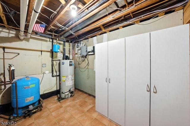 34 Millbrook Rd, Harding Twp, NJ 07976 - unfinished basement featuring gas water heater and a water pressure tank
