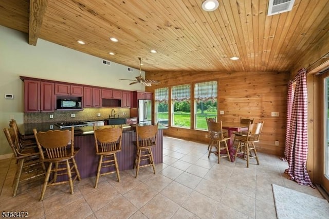 34 Millbrook Rd, Harding Twp, NJ 07976 - kitchen with black microwave, freestanding refrigerator, recessed lighting, light tile patterned floors, and decorative backsplash