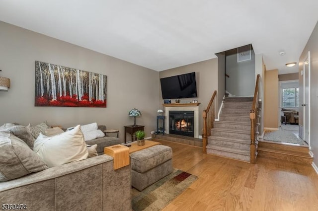 47 Crestmont Rd, Bedminster Twp, NJ 07921 - living area with wood finished floors, stairs, and a fireplace