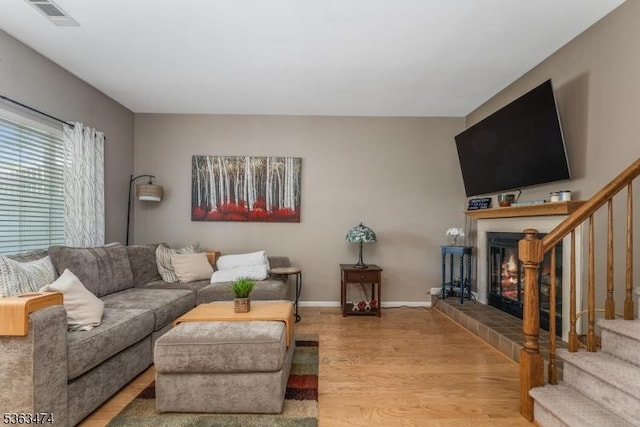 47 Crestmont Rd, Bedminster Twp, NJ 07921 - living area with a fireplace, stairs, and wood finished floors