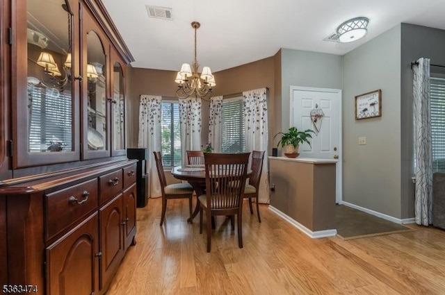 47 Crestmont Rd, Bedminster Twp, NJ 07921 - dining space featuring light wood-style flooring, a chandelier, and baseboards