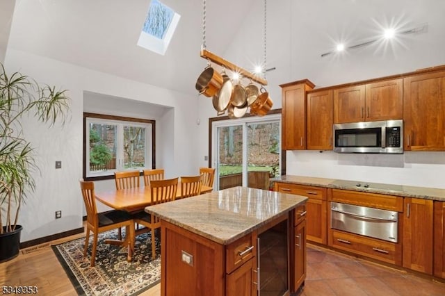 28 David Post Rd, Clinton Twp, NJ 08801 - kitchen featuring stainless steel microwave, a warming drawer, wine cooler, high vaulted ceiling, and brown cabinets