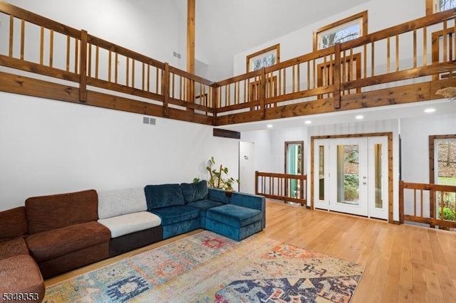 28 David Post Rd, Clinton Twp, NJ 08801 - living area featuring a towering ceiling, wood finished floors, healthy amount of natural light, and recessed lighting