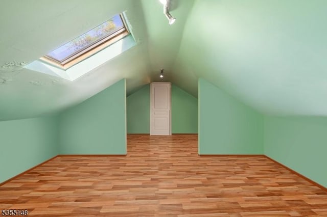 25 W Webster Ave, Roselle Park Boro, NJ 07204 - bonus room featuring light wood finished floors, a skylight, and vaulted ceiling