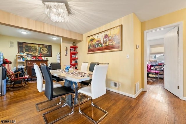 25 W Webster Ave, Roselle Park Boro, NJ 07204 - dining room with a chandelier, wood finished floors, and baseboards