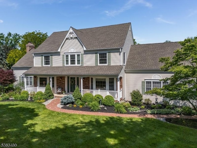 5 Fisher Ct, Raritan Twp, NJ 08822 - victorian-style house featuring covered porch, a front yard, and roof with shingles
