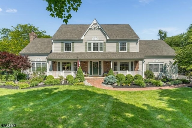 5 Fisher Ct, Raritan Twp, NJ 08822 - view of front facade featuring covered porch, a chimney, a front yard, and roof with shingles