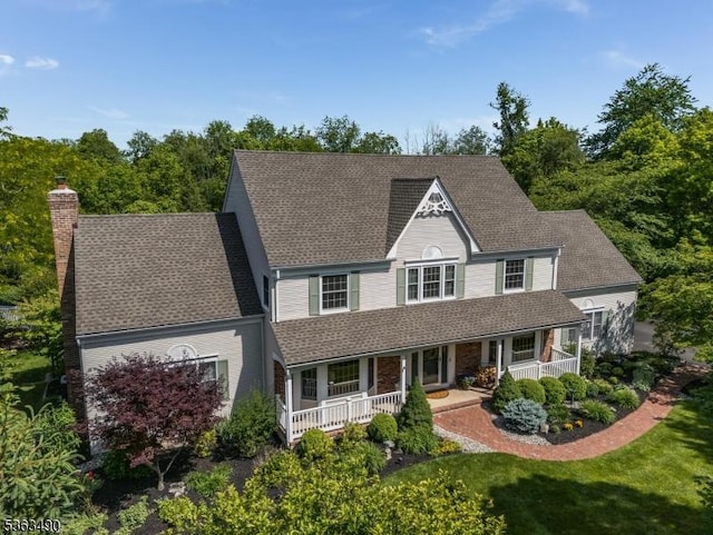 5 Fisher Ct, Raritan Twp, NJ 08822 - view of front facade featuring a porch, a chimney, a shingled roof, and a front lawn