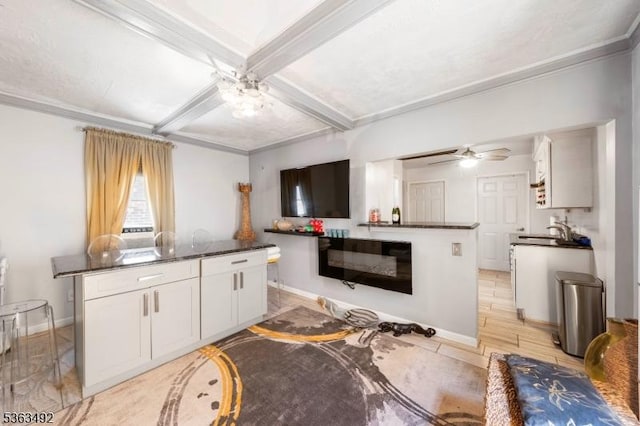 459 Maple Ave Unit 2, Elizabeth City, NJ 07202 - living area featuring ceiling fan, coffered ceiling, ornamental molding, baseboards, and beamed ceiling