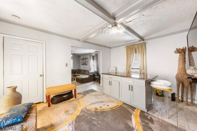 459 Maple Ave Unit 2, Elizabeth City, NJ 07202 - kitchen featuring coffered ceiling, white cabinetry, beamed ceiling, crown molding, and dark countertops