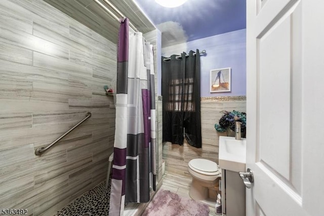 459 Maple Ave Unit 2, Elizabeth City, NJ 07202 - full bath featuring tile walls, a stall shower, and toilet