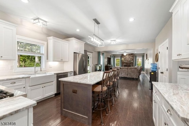 24 Eagles Nest Rd, Green Twp, NJ 07860 - kitchen featuring stainless steel appliances, open floor plan, white cabinets, a center island, and recessed lighting