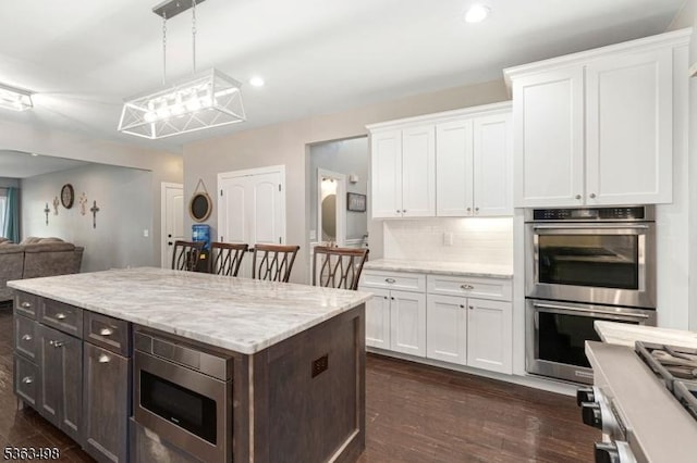 24 Eagles Nest Rd, Green Twp, NJ 07860 - kitchen featuring stainless steel appliances, white cabinets, dark wood-style floors, dark brown cabinets, and open floor plan