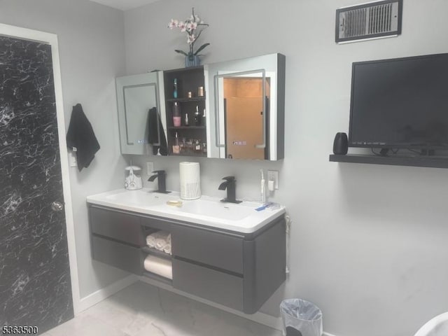 55 Canterbury Ln Unit 55, New Milford Boro, NJ 07646 - bathroom with double vanity and marble look tiles
