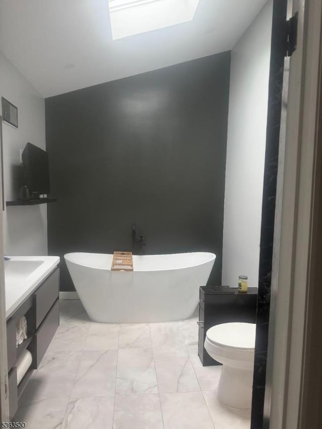 55 Canterbury Ln Unit 55, New Milford Boro, NJ 07646 - bathroom featuring vanity, a freestanding bath, and marble finish flooring