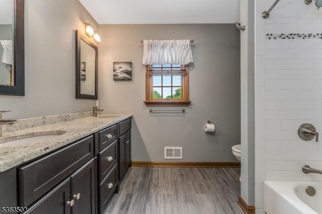 4 Fisher Ct, Raritan Twp, NJ 08822 - full bathroom with double vanity, wood finished floors, and  shower combination