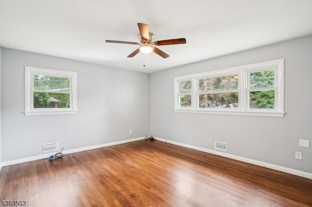 2 Linden Ave, West Orange Twp, NJ 07052 - empty room with healthy amount of natural light, ceiling fan, and wood finished floors