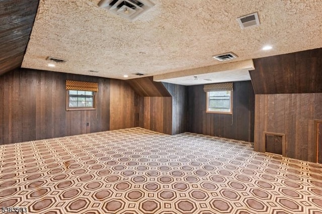 2 Linden Ave, West Orange Twp, NJ 07052 - additional living space featuring wooden walls and a textured ceiling