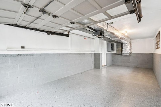 2 Linden Ave, West Orange Twp, NJ 07052 - garage with concrete block wall, electric panel, and a garage door opener
