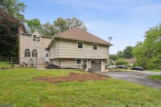 2 Linden Ave, West Orange Twp, NJ 07052 - back of house with asphalt driveway, a garage, and a chimney