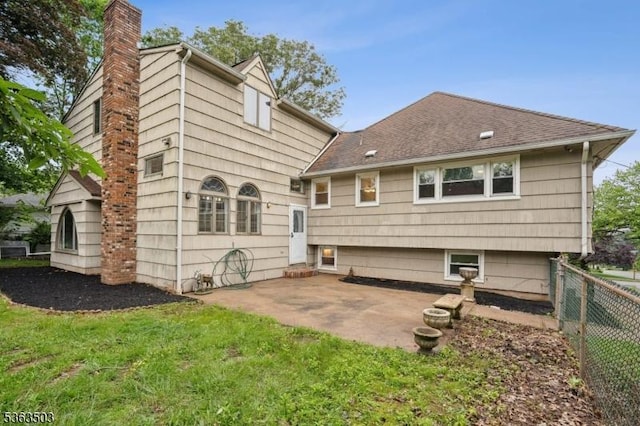 2 Linden Ave, West Orange Twp, NJ 07052 - rear view of house featuring a chimney, a patio, and a shingled roof